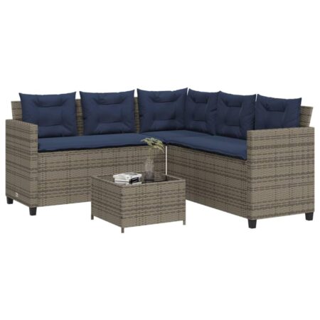 L-formet havesofa med bord og hynder i grå polyrattan